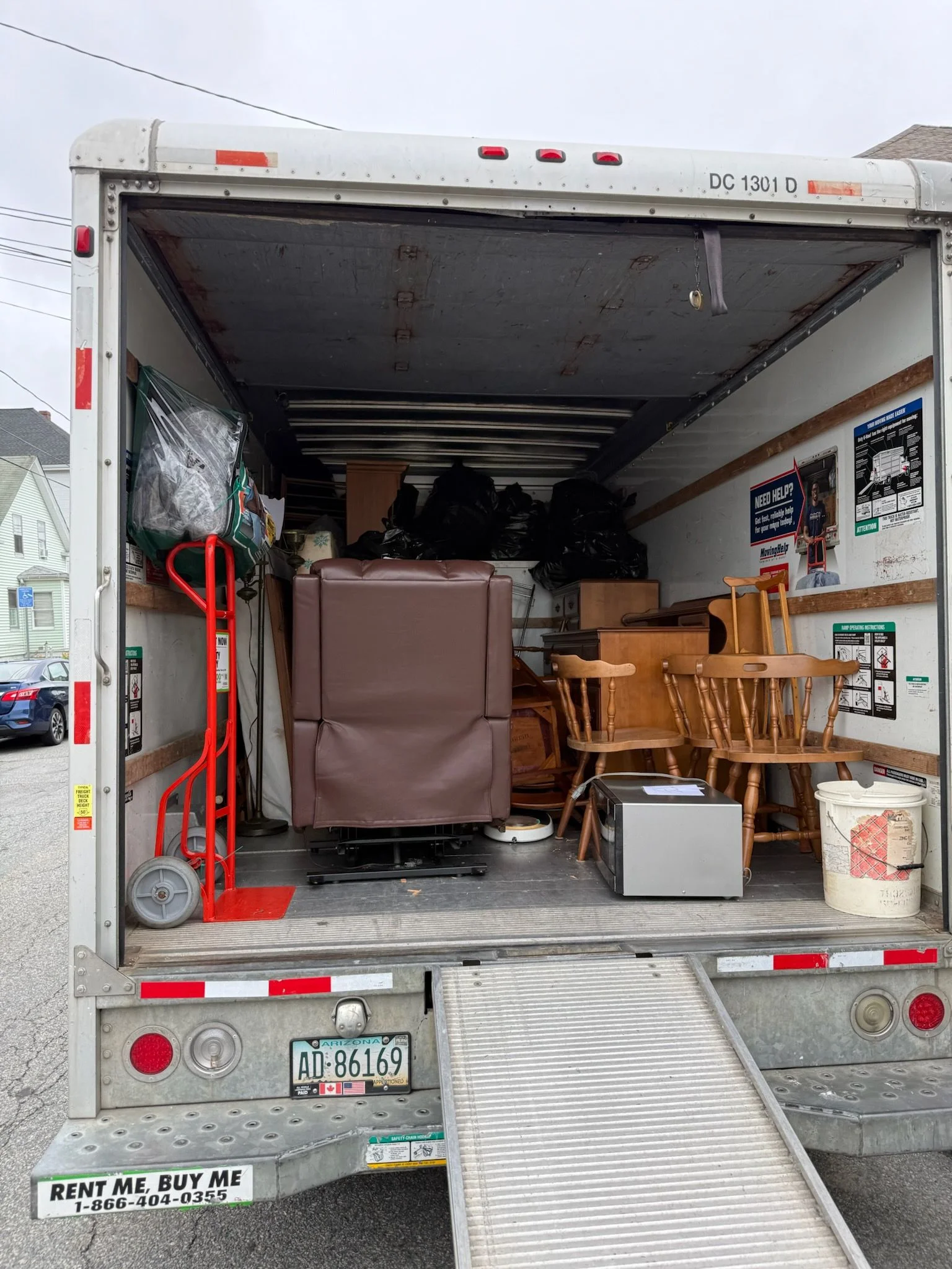 A cleared and empty living room inside an older Taunton, Massachusetts home after a full estate cleanout. Furniture, boxes, and household belongings have been removed, leaving bare floors and clean walls.